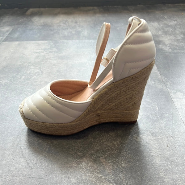 Closed toe high wedge