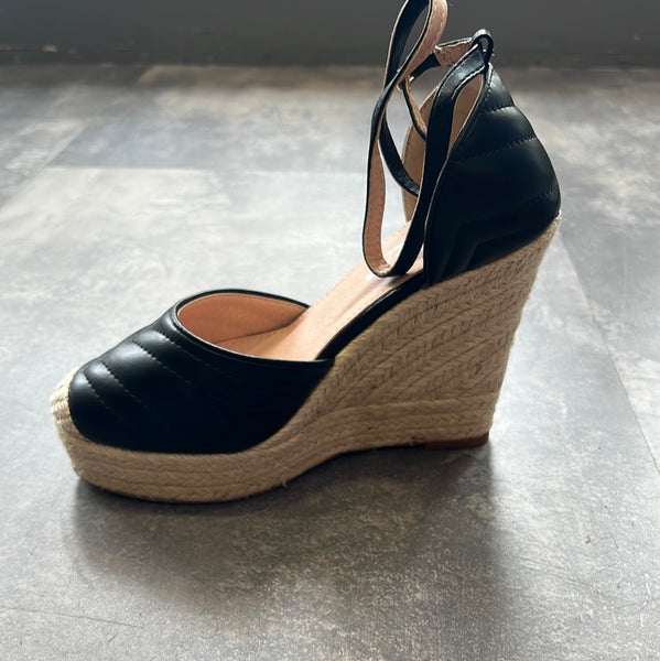 Closed toe high wedge