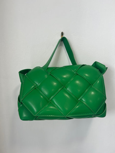 Green woven bag revolve store