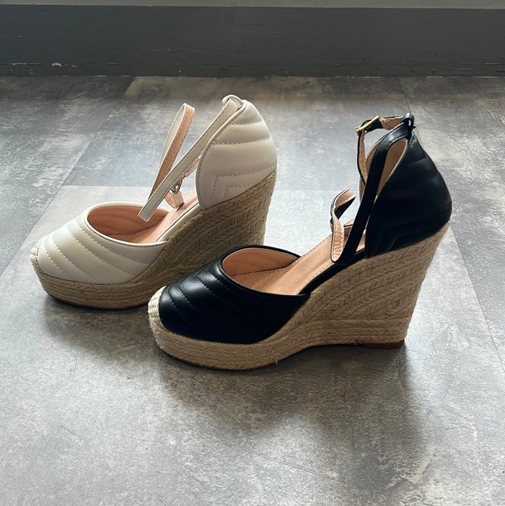 Closed toe high wedge